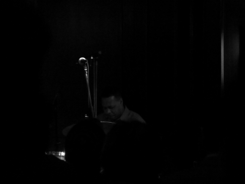 Very dim shot of the drummer